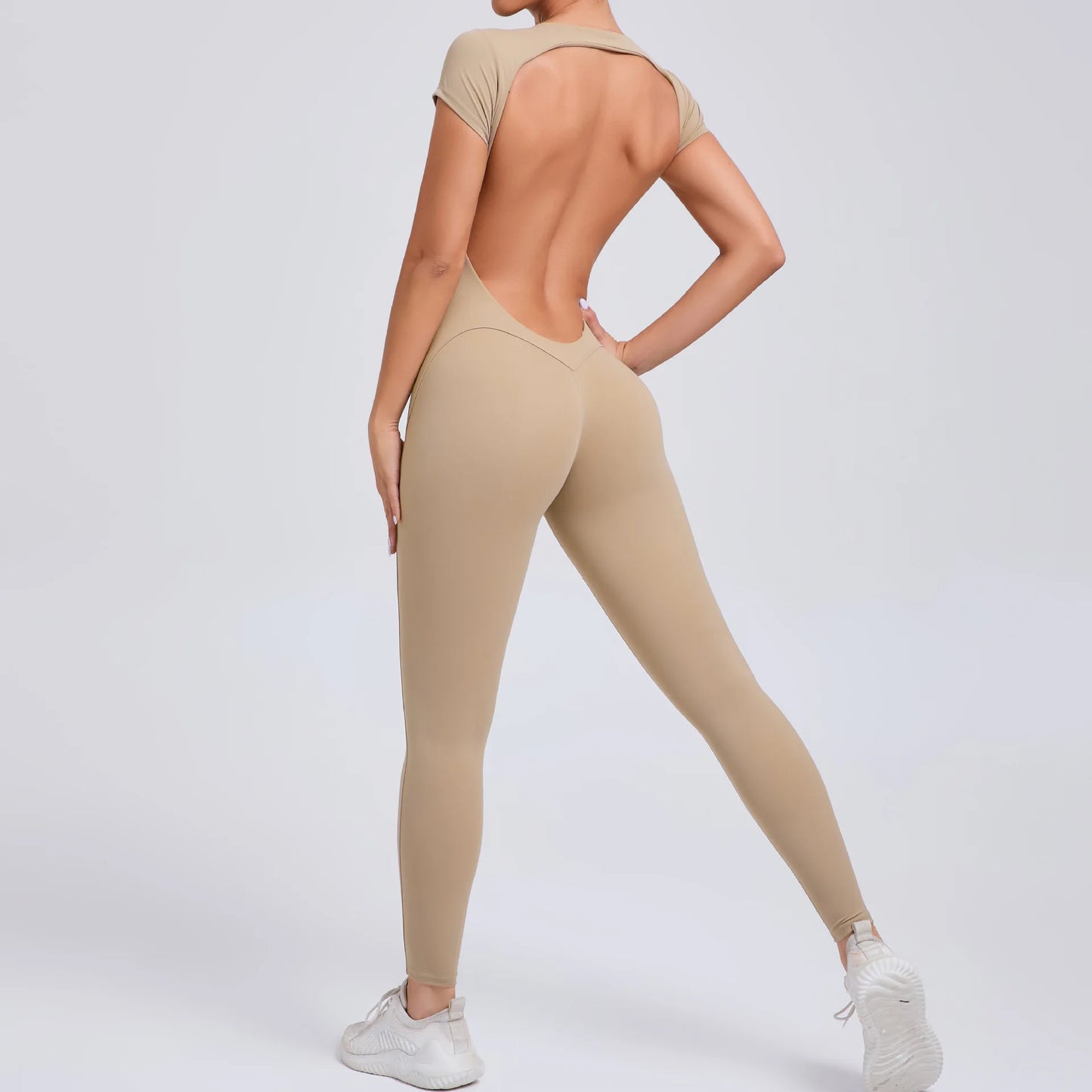 Short-Sleeve Cut-Out Sculpt Jumpsuit - One Piece. Total Freedom.