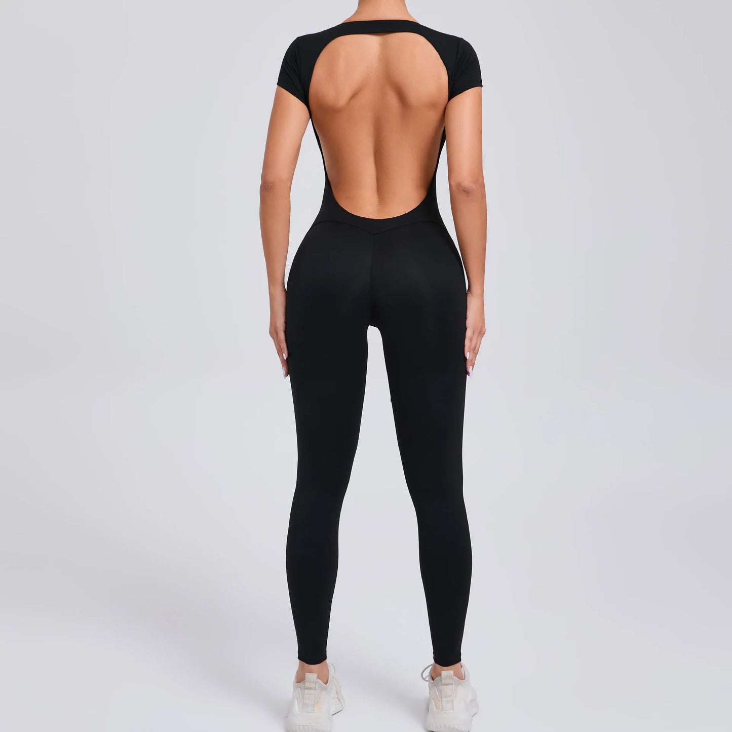 Short-Sleeve Cut-Out Sculpt Jumpsuit - One Piece. Total Freedom.