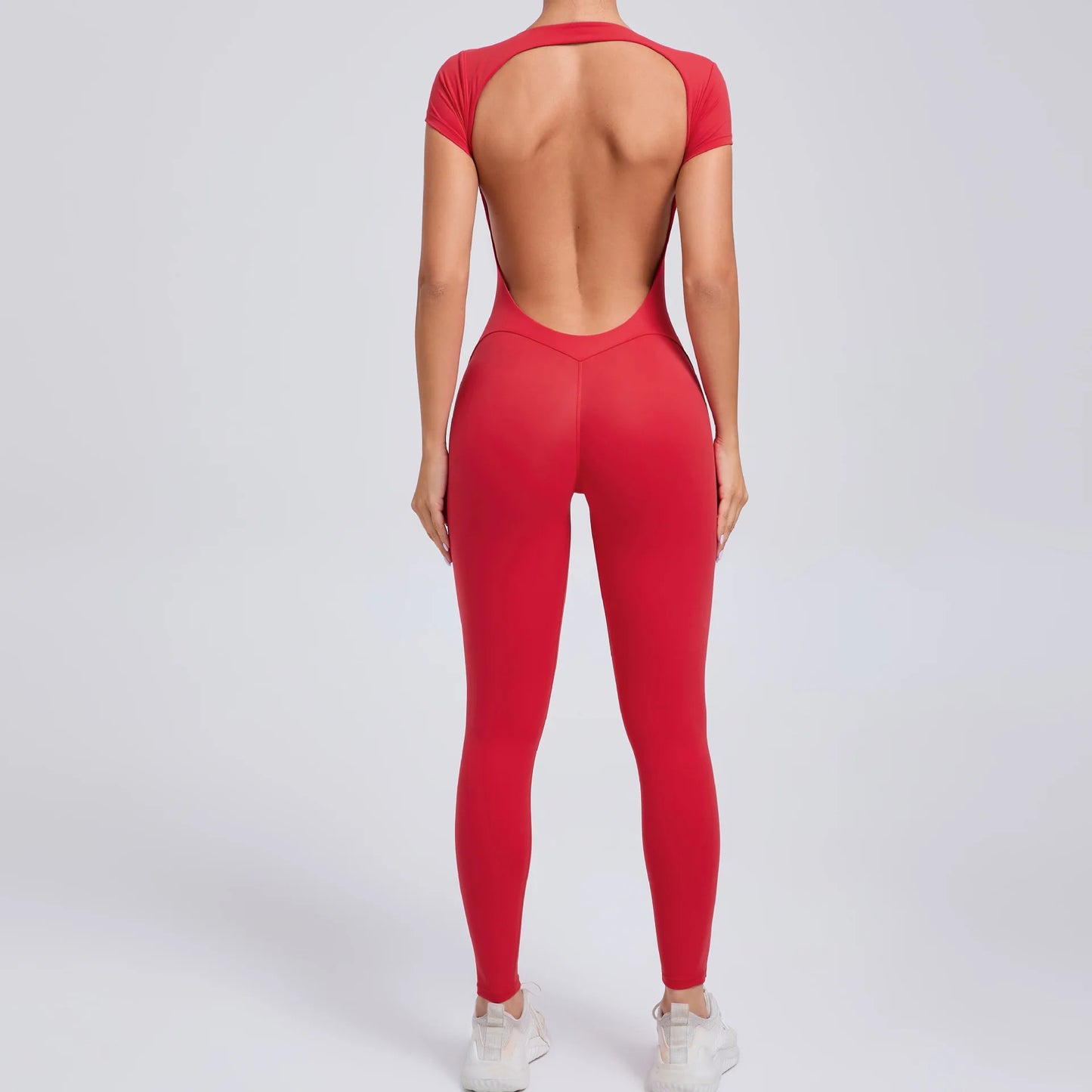Short-Sleeve Cut-Out Sculpt Jumpsuit - One Piece. Total Freedom.