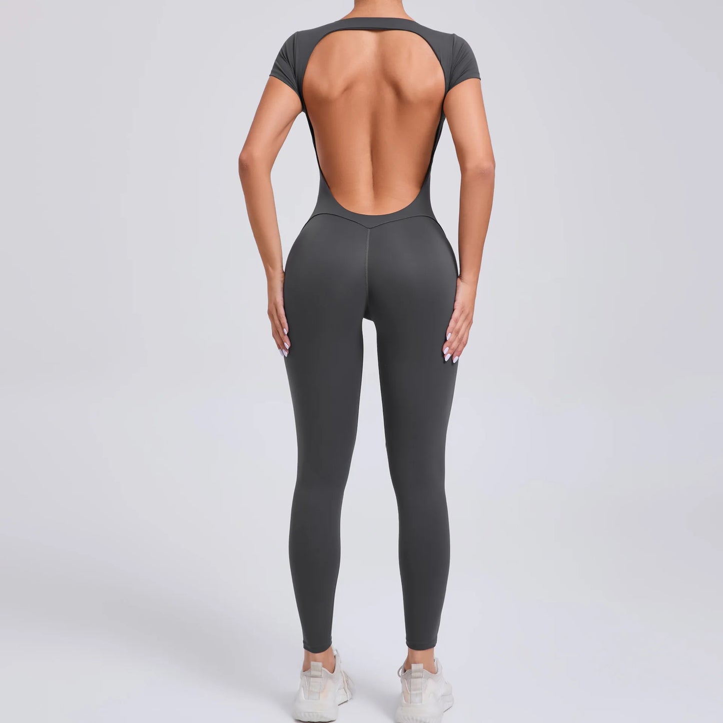 Short-Sleeve Cut-Out Sculpt Jumpsuit - One Piece. Total Freedom.