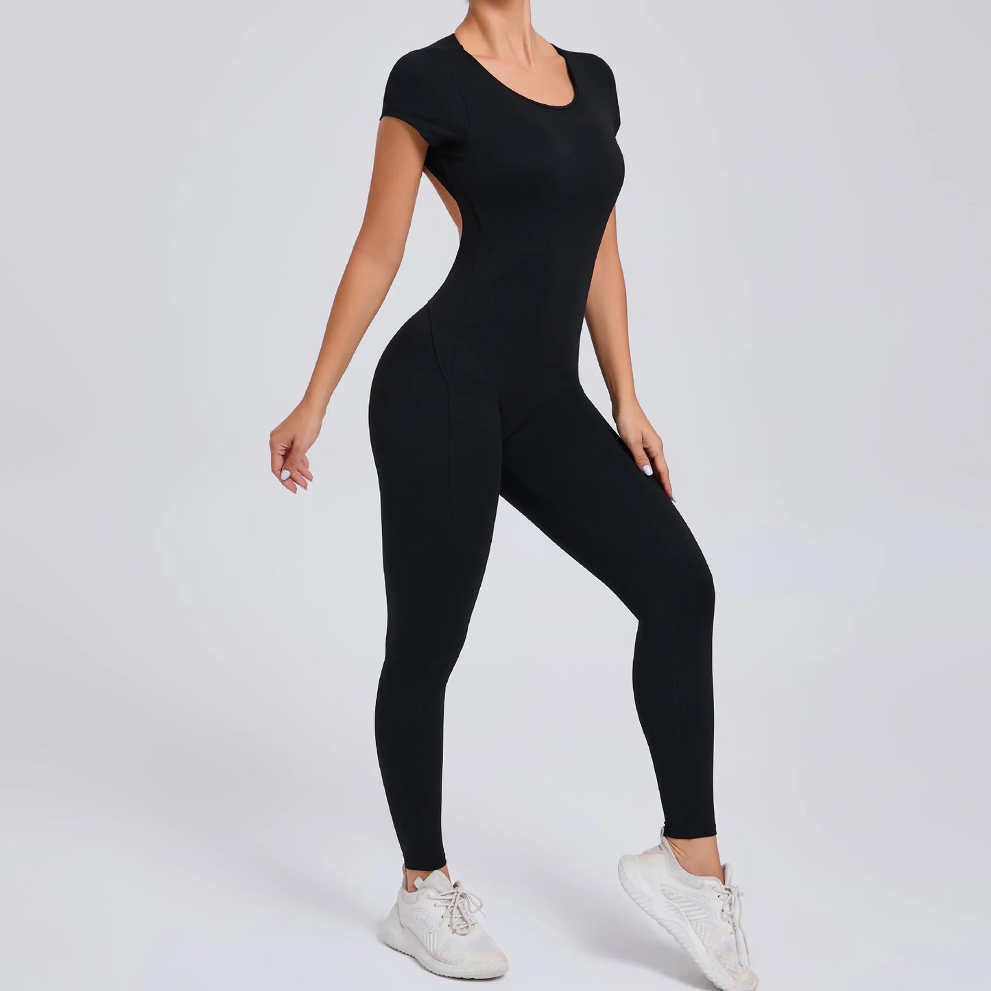 Short-Sleeve Cut-Out Sculpt Jumpsuit - One Piece. Total Freedom.