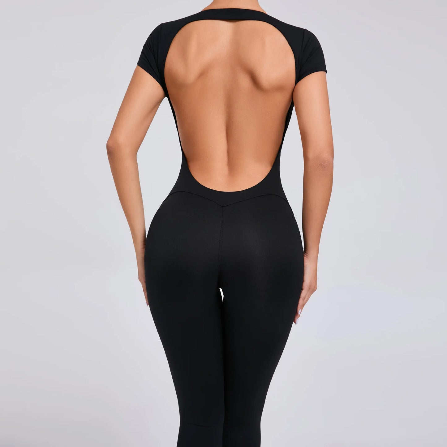 Short-Sleeve Cut-Out Sculpt Jumpsuit - One Piece. Total Freedom.