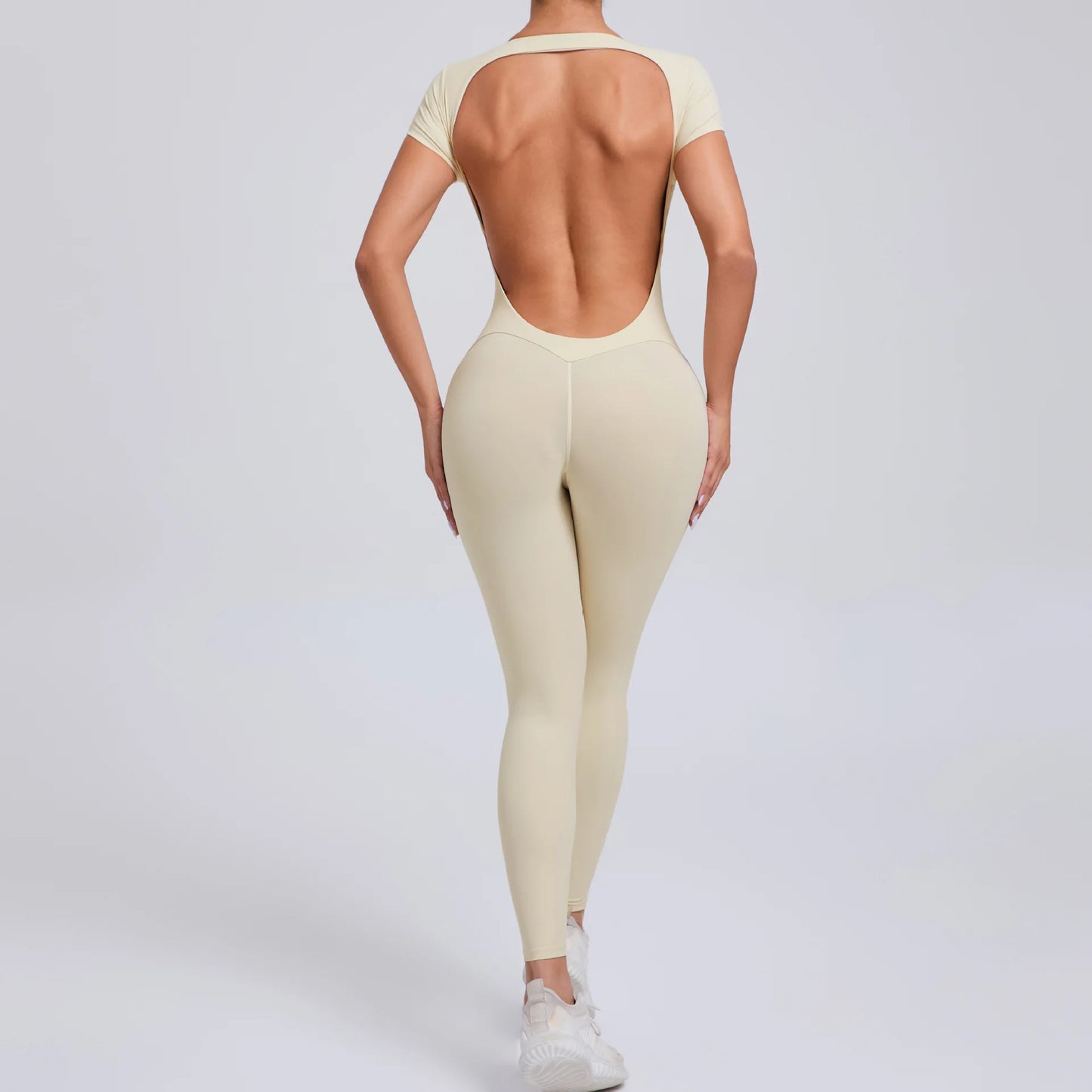 Short-Sleeve Cut-Out Sculpt Jumpsuit - One Piece. Total Freedom.
